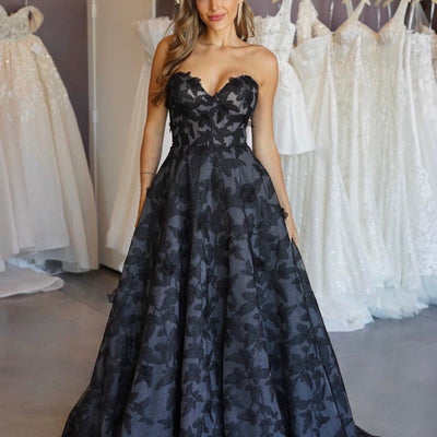 Tokyo gown in black floral organza. Fabric is textured. Sweetheart, strapless design with full a-line skirt.