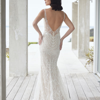 Back view of Tala gown, beaded and sequined in floral and leafy motifs. Plunging back with beaded train.