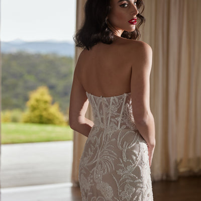 Back view of Tay gown. Heavily beaded figure hugging silhouette. Shown here with tulle straps removed.