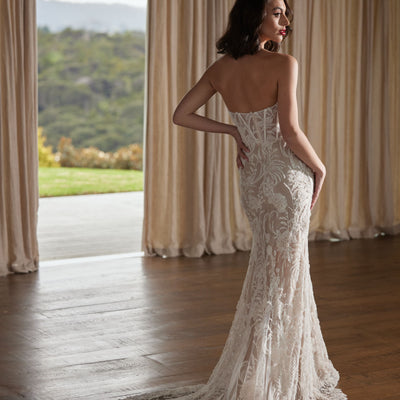 Heavily beaded trumpet silhouette strapless gown. Back view of Tay without tulle straps.