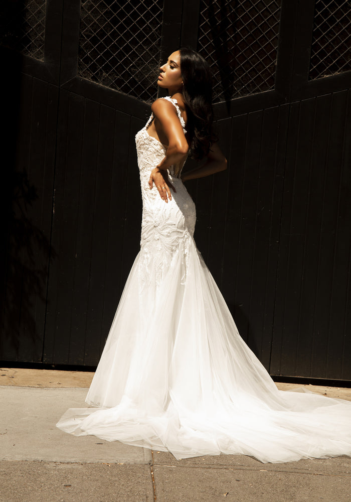 Side view of Louise dress with floral straps and mermaid silhouette with beaded lace. Tulle train.