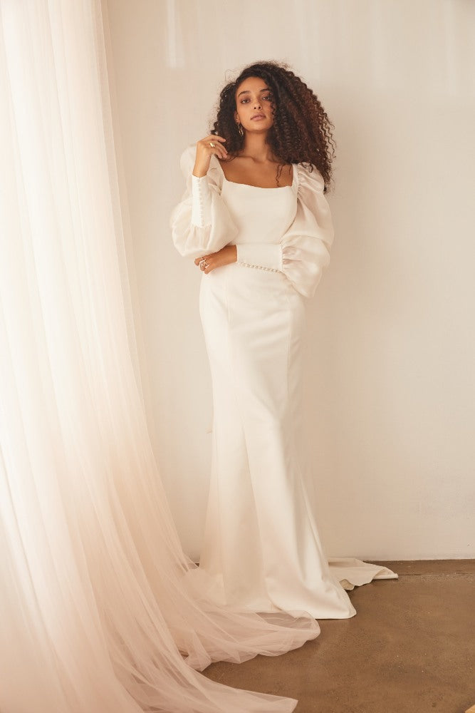 Model wearing Soraya wedding gown with statement sleeves.