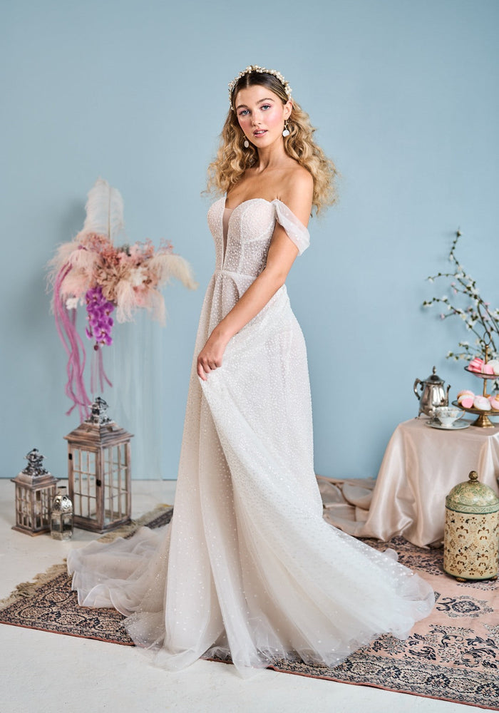 Model wears Stevie wedding dress with glitter lace from the Mademoiselle collection