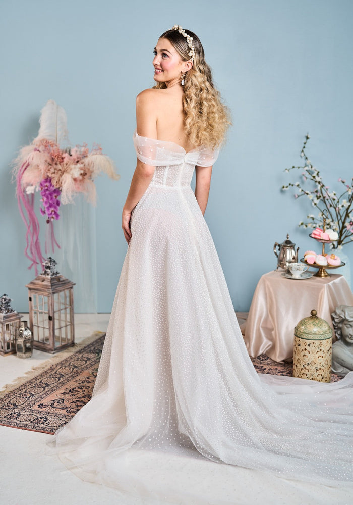 Model wears Stevie wedding dress with glitter lace from the Mademoiselle collection