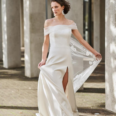 Model wearing Sabrina wedding gown