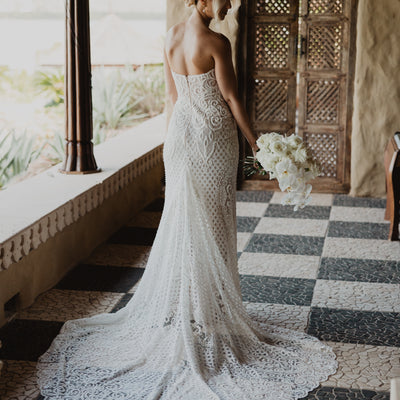 Strapless sweetheart neckline and sheath silhouette, beaded wedding dress.